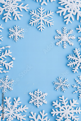 Winter Snowflake Background with Blue Frosty Theme, White Snowflakes, and Copy Space for Christmas and Holiday Designs