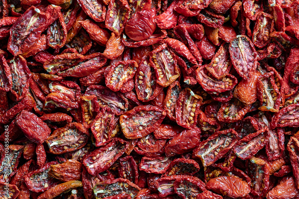 Sun dried red tomato, top view, closeup. Background and texture of dried red tomatoes Sun dried red tomato, top view, closeup. Background and texture of dried red tomatoes