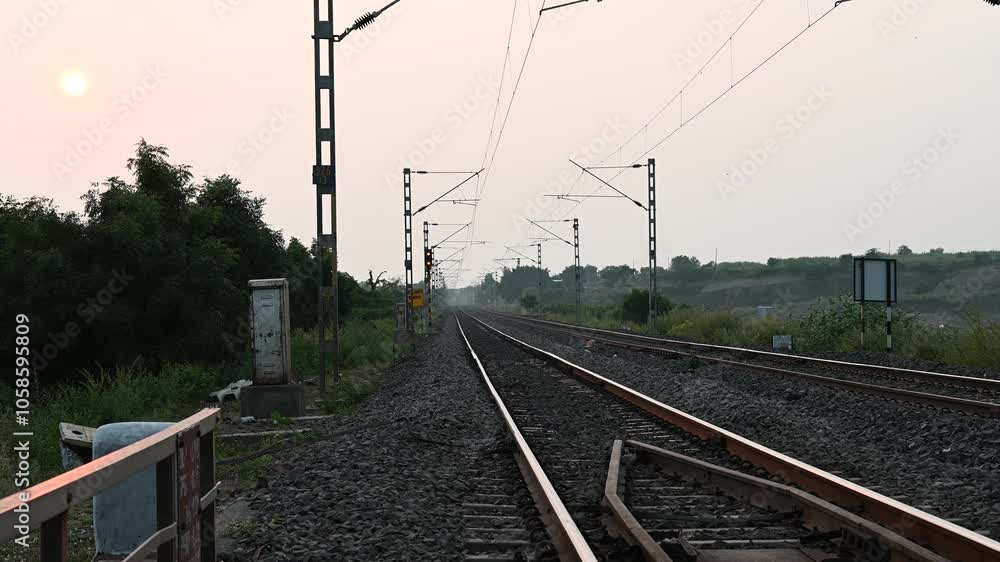 Beautiful view of Indian railway track in India. The train goes on rails. Traffic on the railway Beautiful view of Indian railway track in India. The train goes on rails. Traffic on the railway