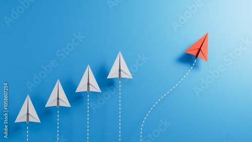 Group of white paper planes in one direction and one red paper plane pointing in different way on blue background. Business for new ideas creativity and innovative solution concepts.