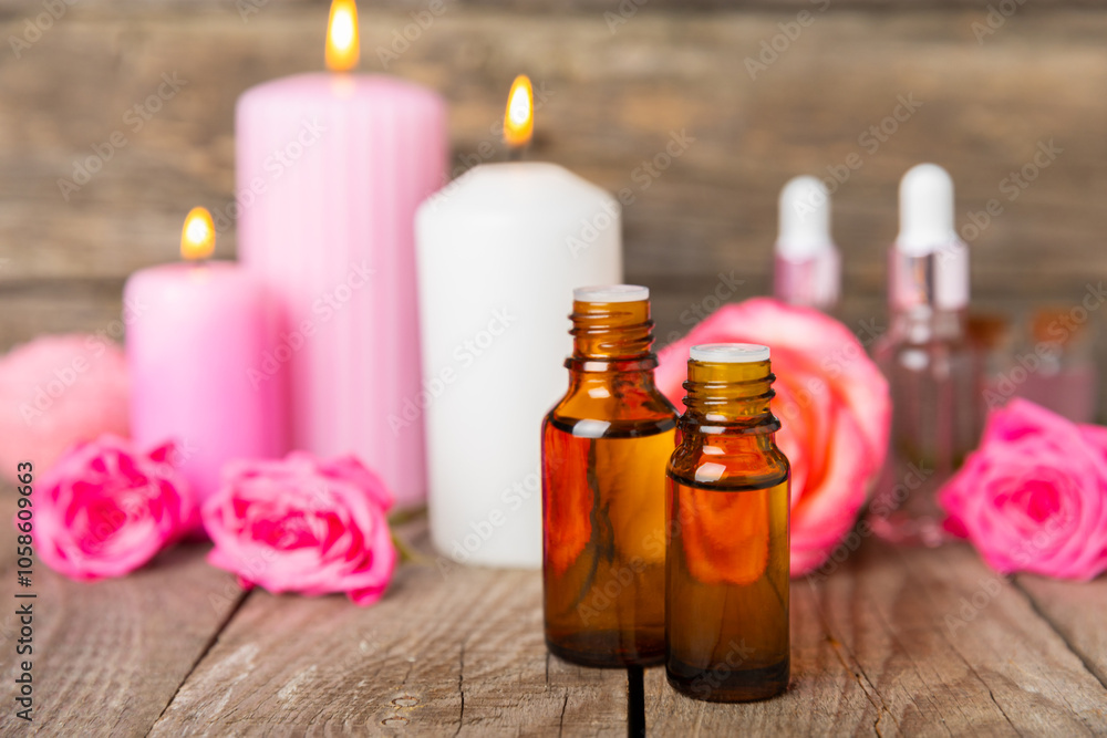 Rose essential oil on a textured background.Roses and a bottle of rose perfumed water.Aromatherapy treatment. Beauty concept. Spa procedure.Natural organic oil.Anti-stress,detox relax.Place for text Rose essential oil on a textured background.Roses and a bottle of rose perfumed water.Aromatherapy treatment. Beauty concept. Spa procedure.Natural organic oil.Anti-stress,detox relax.Place for text