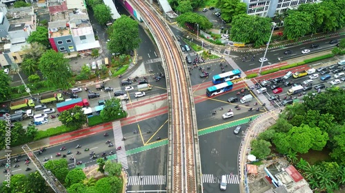 Drone Aerial View of Jakarta’s MRT Rail and Road Busy Traffic from Above