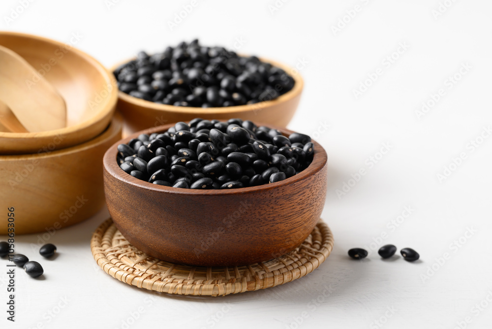 Black bean in wooden bowl on white background, Food ingredient Black bean in wooden bowl on white background, Food ingredient