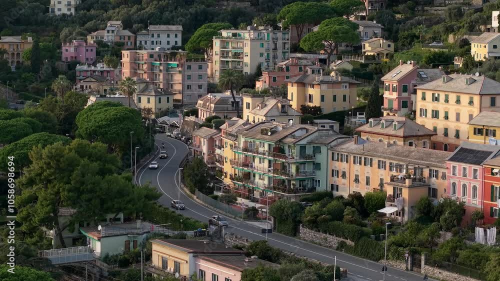Colorful coastal Italian town with vibrant houses and winding roads surrounded by lush greenery Colorful coastal Italian town with vibrant houses and winding roads surrounded by lush greenery