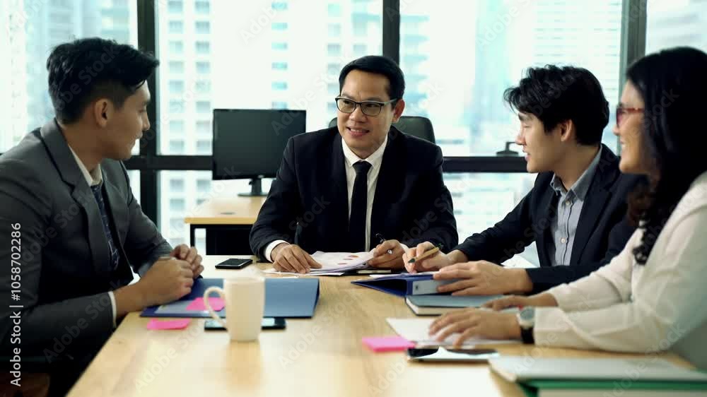 Team of Business people working and discussing about their work and stacking hand in meeting room Team of Business people working and discussing about their work and stacking hand in meeting room