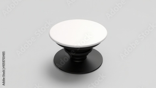 A close-up view of a popsocket mockup with a round, blank surface. Clean, minimalistic image with soft lighting, perfect for showcasing custom design options.