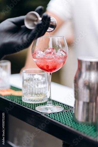 bartender pouring cocktail