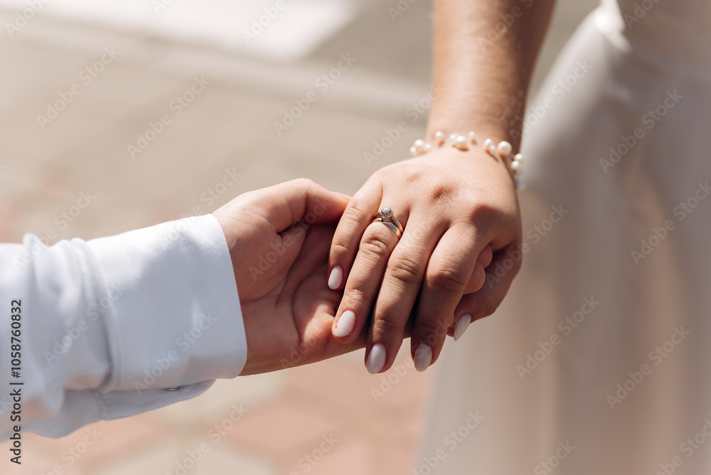 bride and groom holding hands