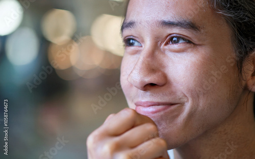 Thinking Face with Inspiration: A close-up of a person’s thoughtful expression, slightly smiling as if inspired