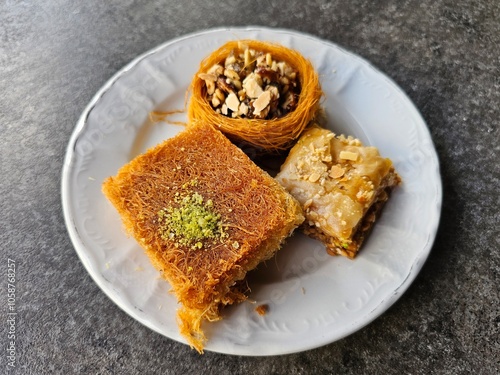 Fotografija top view of syrian sweets served in a white plat