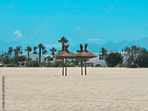 view of beach umbrellas in Cabo Negro Beach, Martil. a beach resort in northern Morocco, to the north of Tetouan photo