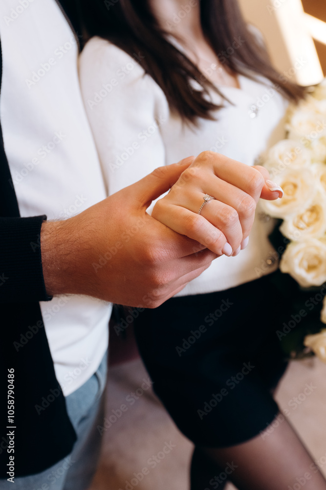 hands of bride and groom with rings