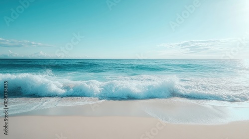 Beautiful white sand beach with turquoise sea waves under a clear blue sky, creating a serene environment perfect for relaxation and ideal for adding a personal touch in the copy space.