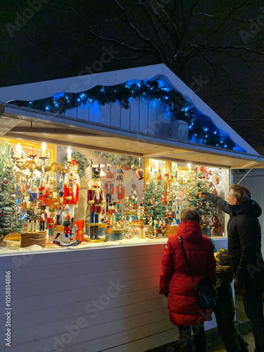 Holiday Spirit in the Air at the Christmas Market Stall. Holiday Shopping Under Twinkling Lights.