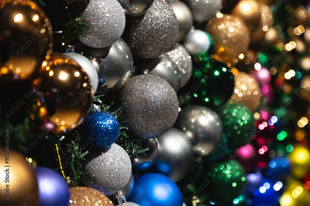 Close-up, Christmas balls of different colors on a Christmas tree as a background. Copy space. Close-up, Christmas balls of different colors on a Christmas tree as a background. Copy space.