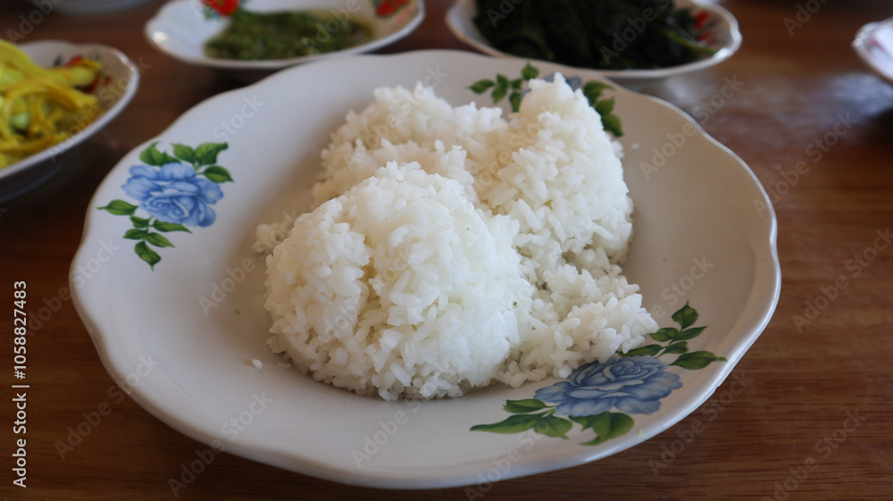 white rice at wite plate at Minang restaurant white rice at wite plate at Minang restaurant