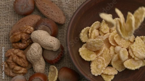 An assortment of various nuts and snack cereals displayed on a rustic wooden background