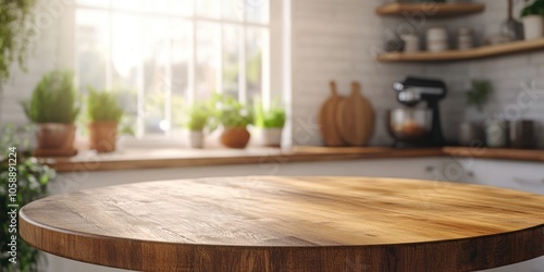 This image features a circular wooden table in the center of a kitchen, showcasing its modern design and natural wood finish. The table is surrounded by various kitchen appliances and decor