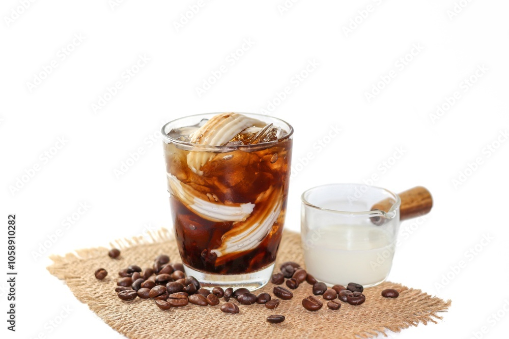 Ready for drink with Americano ice coffee mix with coconut water serving with coconut slices for topping on white background and isolate photo style ,coffee beans spread and coconut slices. Ready for drink with Americano ice coffee mix with coconut water serving with coconut slices for topping on white background and isolate photo style ,coffee beans spread and coconut slices.