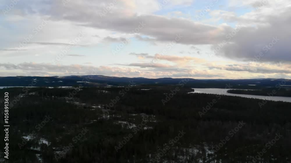 Drone shot of a snowy landscape in Sweden. Drone shot of a snowy landscape in Sweden.