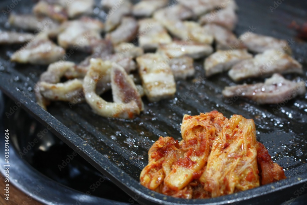 Delicious kimchi and pork on the grill Delicious kimchi and pork on the grill