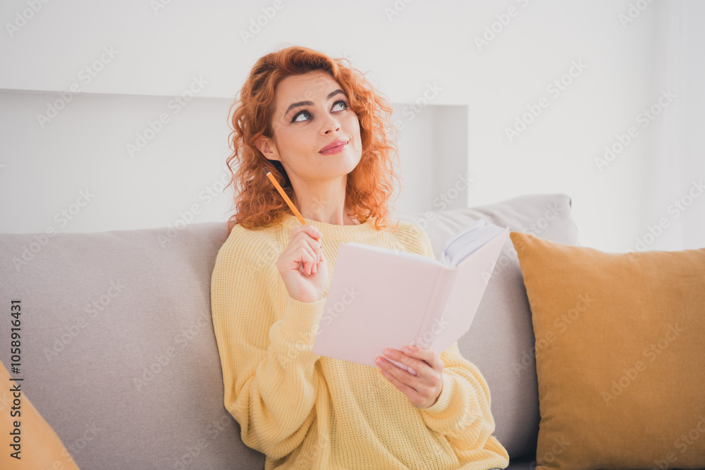 Photo of adorable sweet lady wear yellow sweatshirt writing book indoors room home house Photo of adorable sweet lady wear yellow sweatshirt writing book indoors room home house