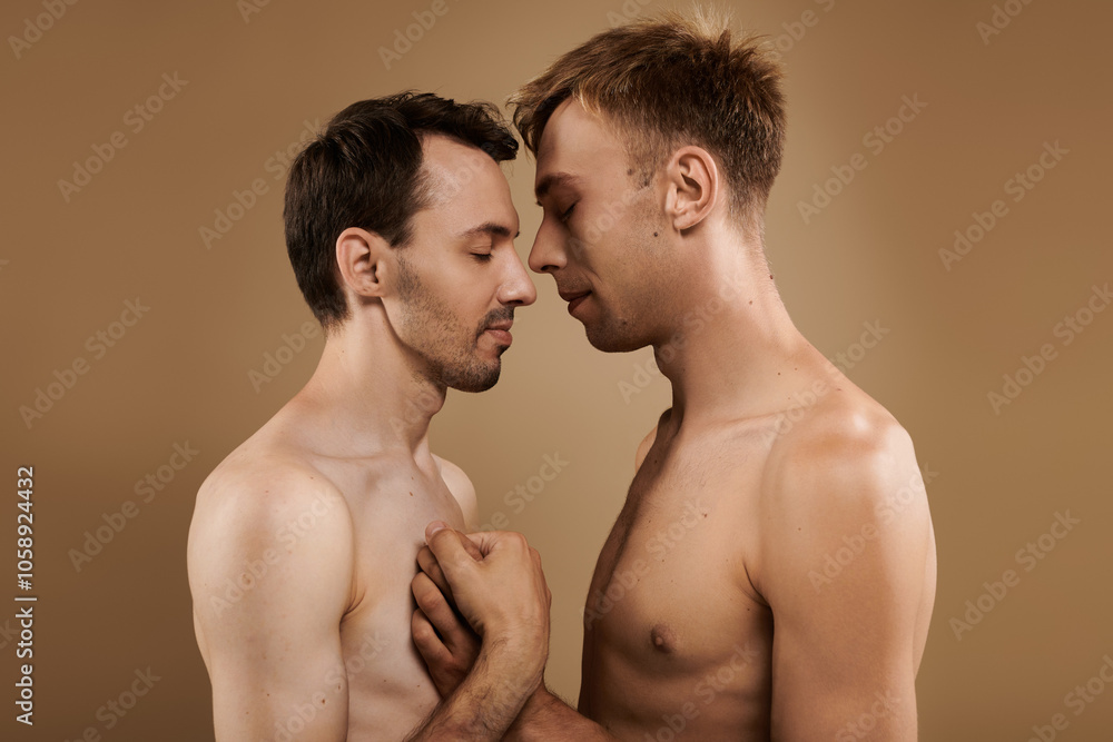 Two young men share a close, affectionate moment, embracing and connecting deeply. Two young men share a close, affectionate moment, embracing and connecting deeply.