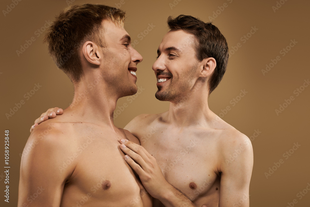 A young couple shares affectionate smiles and embraces, celebrating their love joyfully. A young couple shares affectionate smiles and embraces, celebrating their love joyfully.