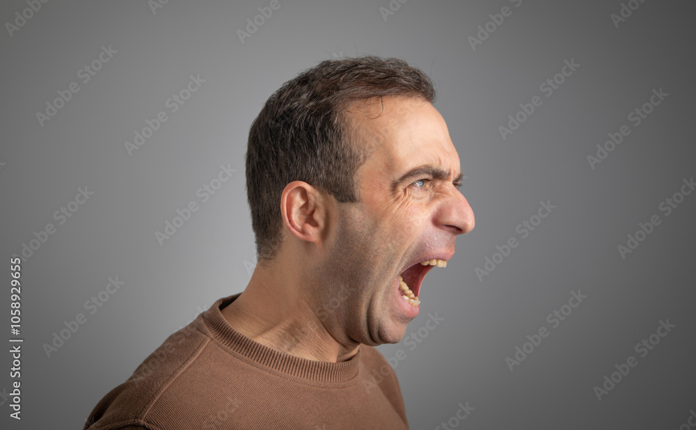 Fototapeta premium Caucasian young angry man screaming.