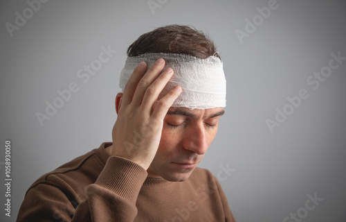 Obraz na płótnie Caucasian man with a bandage on head.