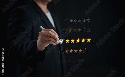 Photography businessman uses stylus pen to give a 5-star rating, satisfaction and appreciati