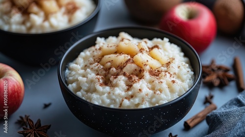 Milk rice topped with cinnamon and applesauce photo