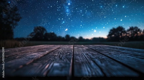 Wooden table beneath a starry sky evoking a peaceful and enchanting atmosphere in an outdoor environment