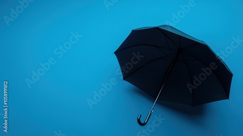 Black Umbrella on Blue Background for Creative Use