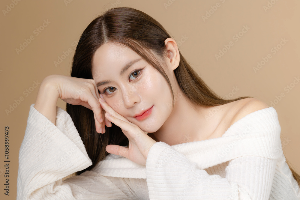 Young Asian beauty woman long hair with korean makeup style on face and perfect clean skin on isolated beige background. Female model, Facial treatment, Cosmetology, plastic surgery. Young Asian beauty woman long hair with korean makeup style on face and perfect clean skin on isolated beige background. Female model, Facial treatment, Cosmetology, plastic surgery.