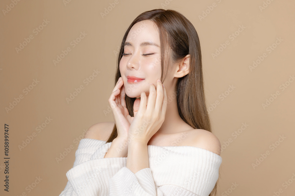 Young Asian beauty woman long hair with korean makeup style on face and perfect clean skin on isolated beige background. Female model, Facial treatment, Cosmetology, plastic surgery. Young Asian beauty woman long hair with korean makeup style on face and perfect clean skin on isolated beige background. Female model, Facial treatment, Cosmetology, plastic surgery.