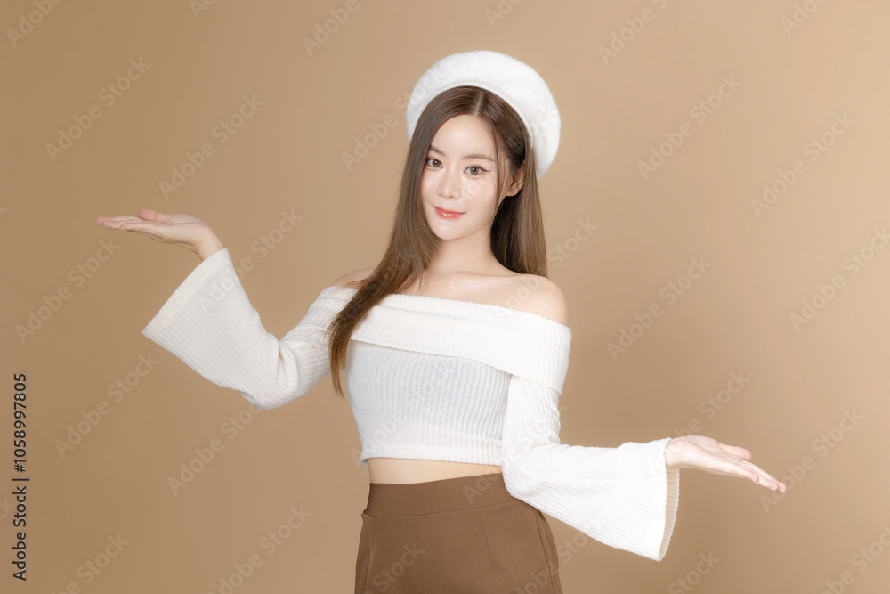 Young Asian beauty woman long hair with beret lovely face and perfect clean skin on isolated beige background. Female model, Facial treatment, Cosmetology, plastic surgery. Young Asian beauty woman long hair with beret lovely face and perfect clean skin on isolated beige background. Female model, Facial treatment, Cosmetology, plastic surgery.