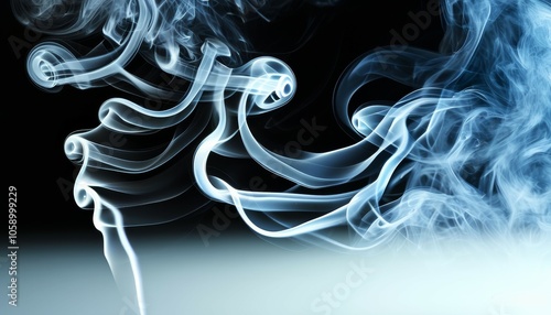 intertwining wavy clouds of smoke wriggle like snakes on a dark background in gray-blue colors photo