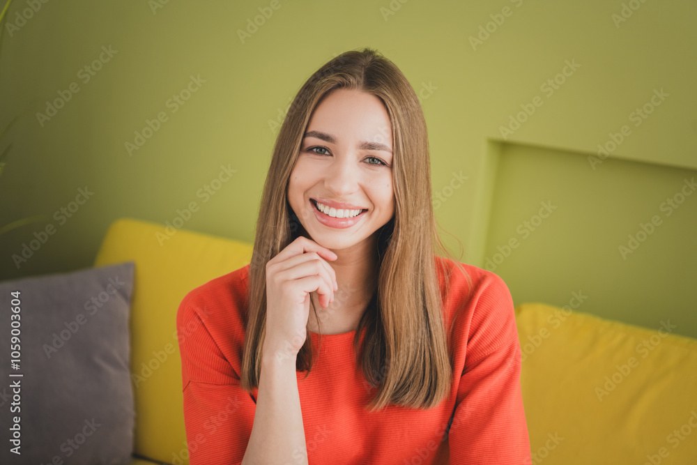 Photo of nice young girl touch chin thinking wear orange clothes enjoy modern bright cozy spring interior flat indoors Photo of nice young girl touch chin thinking wear orange clothes enjoy modern bright cozy spring interior flat indoors