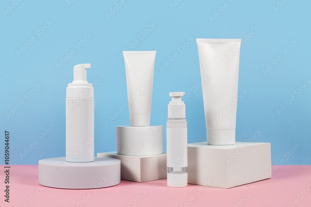 Beautiful cosmetic templates for ads, plastic cream tubes and bottles on a blue background with podiums. Beautiful cosmetic templates for ads, plastic cream tubes and bottles on a blue background with podiums.