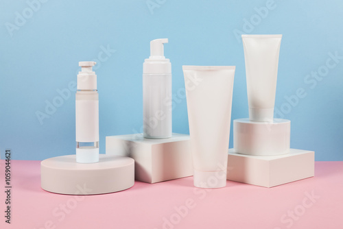 White plastic tubes without label displayed on podium. Scene for advertising cosmetics base