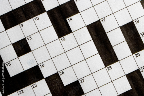Empty, unfinished crossword puzzle, black and white crossword puzzle. On black background. 