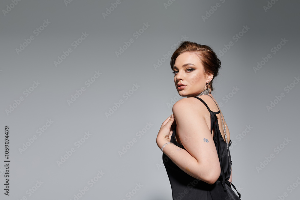 A beautiful young woman poses gracefully, highlighting her elegant attire and captivating presence. A beautiful young woman poses gracefully, highlighting her elegant attire and captivating presence.