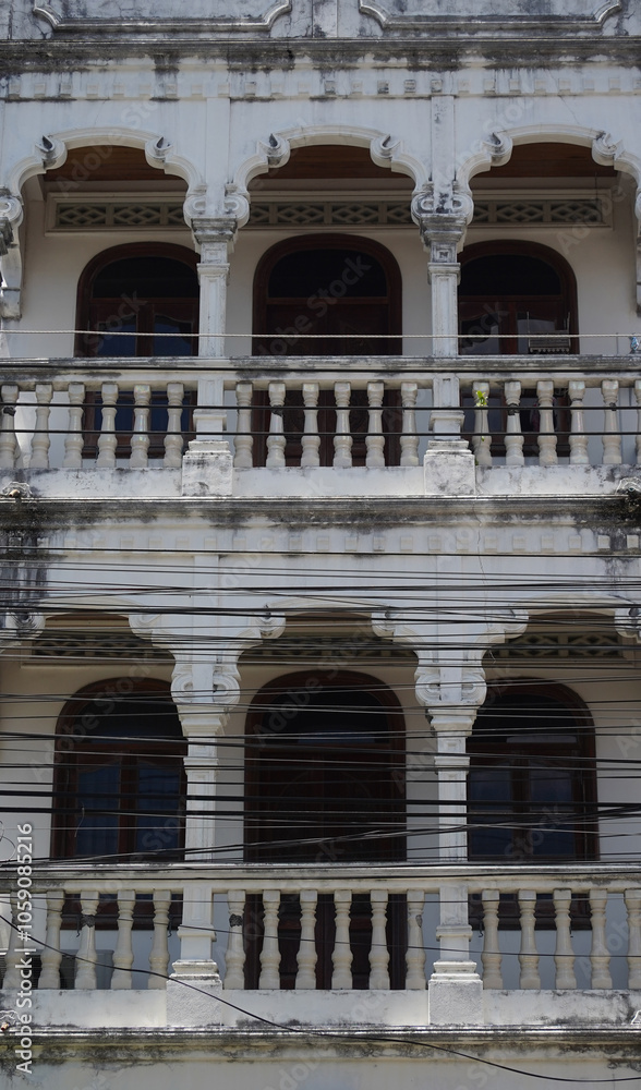 Obraz premium Detailed view of windows, doors and balconies of city buildings 