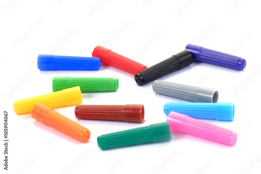Various colorful paint pens on a white background. Various colorful paint pens on a white background.