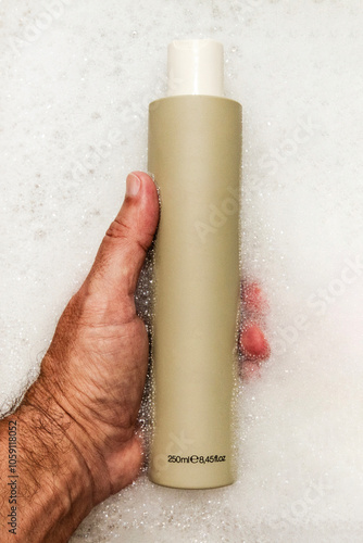 Man hair shampoo in man hand