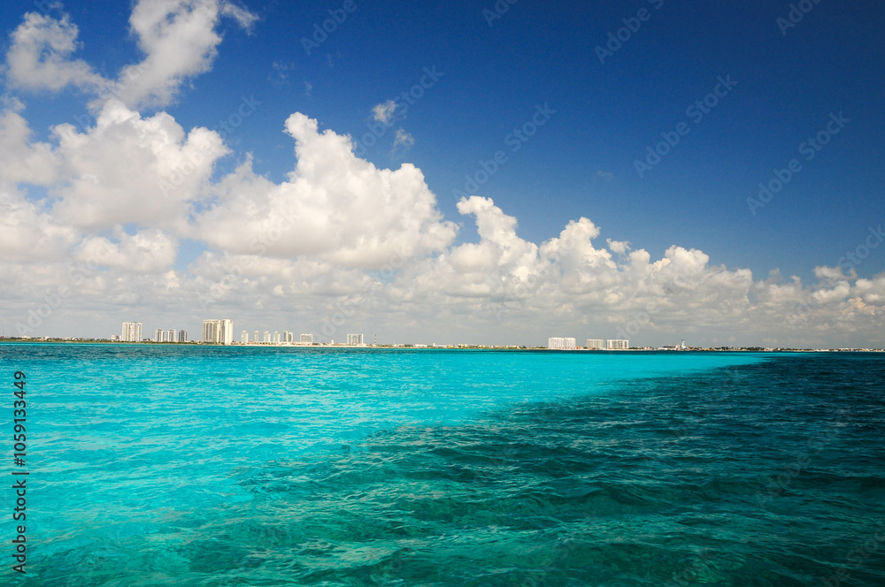 Turquoise waters and blue sky off Isla Mujeres, a serene tropical paradise. Turquoise waters and blue sky off Isla Mujeres, a serene tropical paradise.