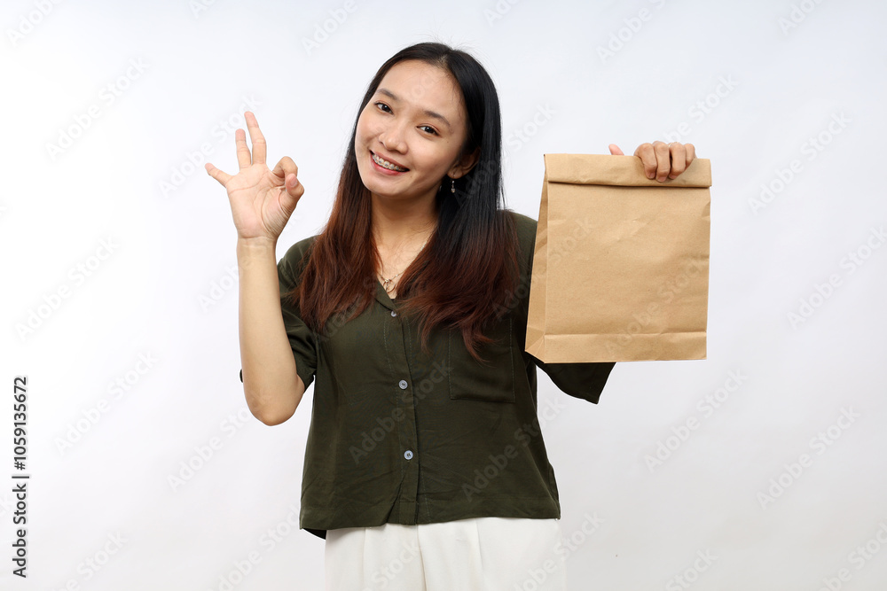 young asian woman feeling happy, showing approval with okay gesture. take away delivery concept young asian woman feeling happy, showing approval with okay gesture. take away delivery concept