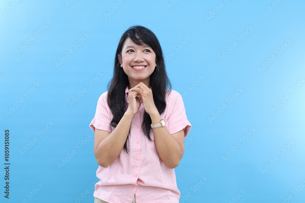 Cheerful thoughtful Asian female keeps hands under chin, hopes for something awesome, isolated on white background Cheerful thoughtful Asian female keeps hands under chin, hopes for something awesome, isolated on white background