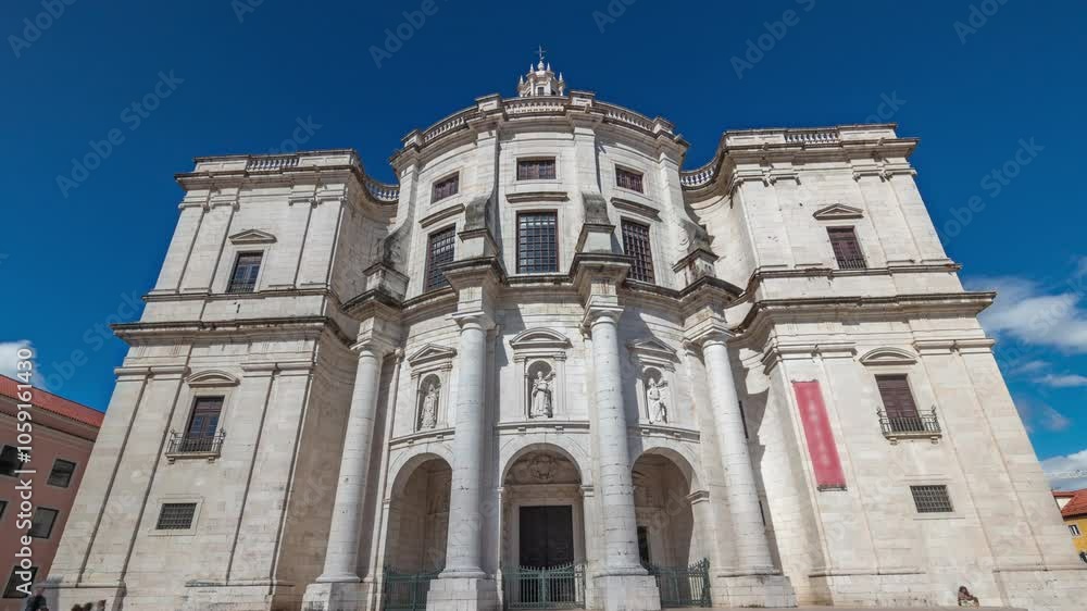 Entrance and main facade of National Pantheon aerial timelapse hyperlapse (The Church of Santa Engracia), a 17th-century monument in downtown Lisbon. Clouds on a blue sky. Portugal. Entrance and main facade of National Pantheon aerial timelapse hyperlapse (The Church of Santa Engracia), a 17th-century monument in downtown Lisbon. Clouds on a blue sky. Portugal.